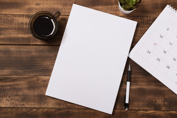 top view image of open notebook with blank pages next to cup of coffee on wooden table. ready for adding text or mockup. - Powered by Adobe