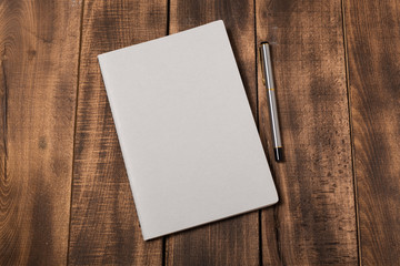 Fototapeta premium Mock-up magazine or catalog on wooden table.