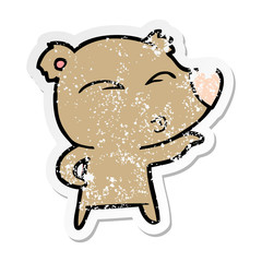 distressed sticker of a cartoon whistling bear