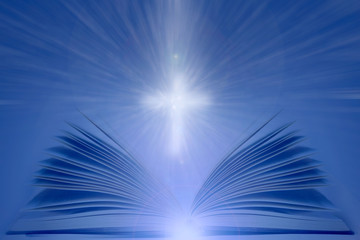Open Bible with shining cross. Christian religion background