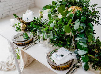 Wedding. Banquet. The chairs and table for guests, served with cutlery and crockery