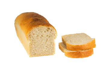 A traditional square loaf of bread is isolated on a white background.   bread isolated on a white background. square loaf of bread with two pieces cut off on a white background. 