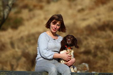woman with dog in autumn park