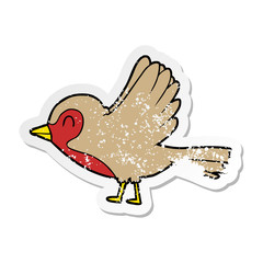 distressed sticker of a cartoon robin taking flight
