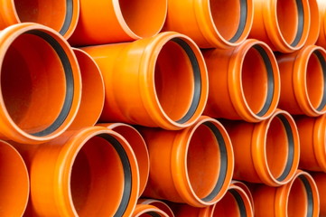 Orange plastic plumbing pipes.