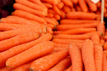 A row of orange carrots in the fruit market