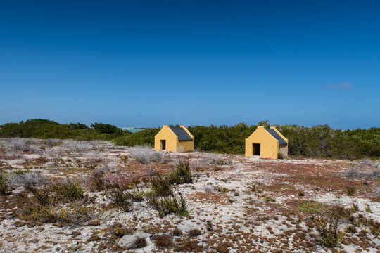 Historical slave huts of the salt mine workers near the salt pan on the tropical island of Bonaire in the Netherlands Antilles