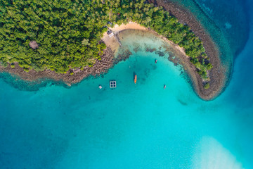 Fototapeta premium Aerial view of idyllic tranquil sea island deep blue turquoise water