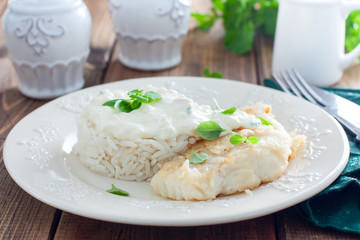 Fried cod, cooked with rice and cream sauce, horizontal
