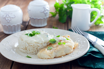 Fried cod, cooked with rice and cream sauce, horizontal