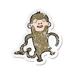 retro distressed sticker of a cartoon monkey