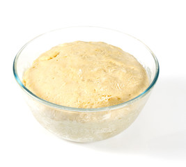 raw dough in a glass bowl