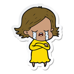 sticker of a cartoon girl crying