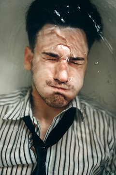 Businessman Trying To Drown Himself In Bathtub