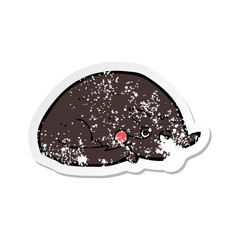 retro distressed sticker of a cartoon curled up dog
