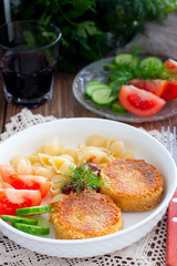Chickpea cutlets with vegetables and pasta, selective focus