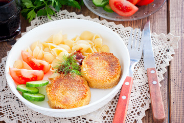 Chickpea cutlets with vegetables and pasta, selective focus