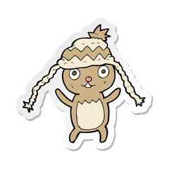 sticker of a cartoon bear in hat