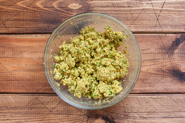Step-by-step cooking chickpea falafel - step 5 - mixing ingredients, top view, selective focus