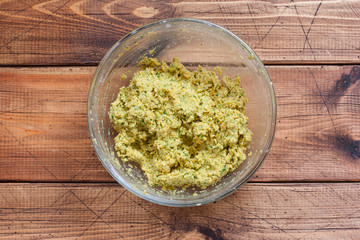 Step-by-step cooking chickpea falafel - step 5 - mixing ingredients, top view, selective focus