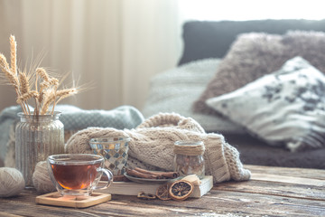 Still life details of home interior on a wooden table with a Cup of tea