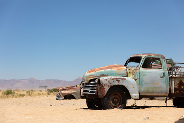 Fototapeta na wymiar Abandoned truck in Solitaire / Namibia Desert