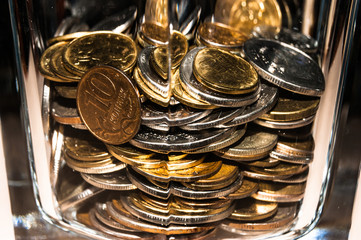Russian coins of different denominations in a glass jar