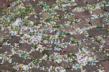 closeup of paper confetti on cobblestone background