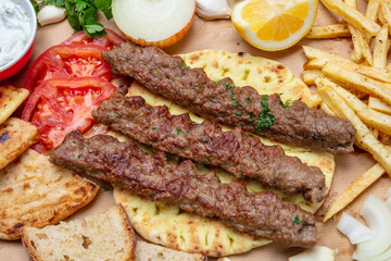 Kebab, traditional turkish, greek meat food on pita bread, top view