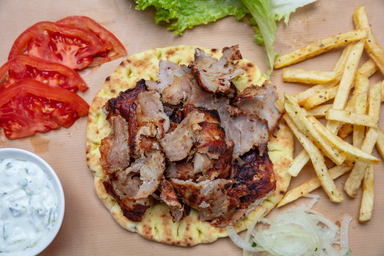 Shawarma, gyros pita. Traditional turkish, greek meat food on pita bread
