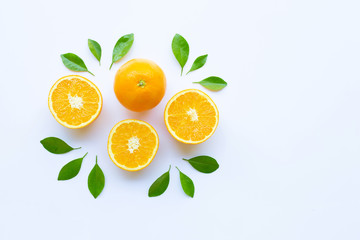 Fresh orange citrus fruit with leaves isolated on white.