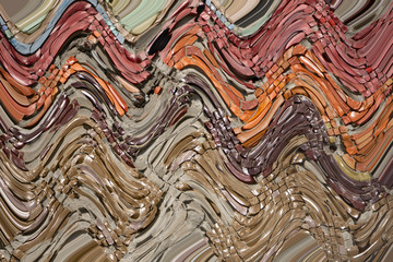 Multicolored quilling paper curved stripes forming a bright background.