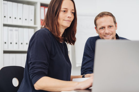 Woman and man working at computer
