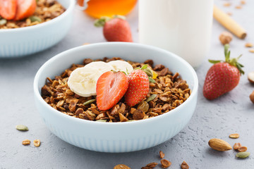 Oat granola with strawberry and banana. Healthy breakfast.