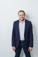 Relaxed confident businessman smiling at camera