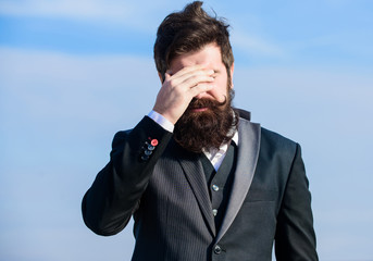 Unforgivable mistake. Business failure. Man bearded stressful painful face sky background. Guy suffer headache stressful day. Stressful business. Pain and migraine. Frustration and disappointment