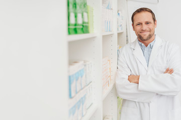 Confident male pharmacist with a lovely smile