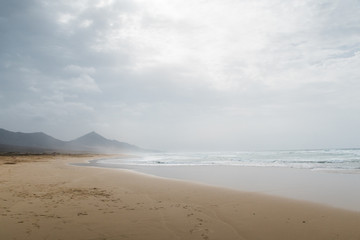 Beautiful Beach Landscape with sand on a cloudy day