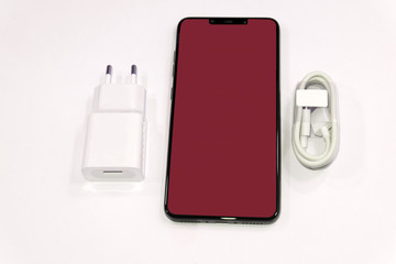 black smart phone with blank screen isolated on white background .