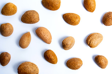 Fresh almonds on white flat lay