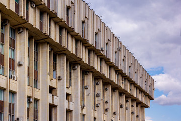 corner of large concrete building against the sky