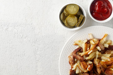 Crispy pan fried potatoes with pork, pickles and tomato ketchup sauce