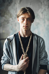 Junkie with noose around neck, gonna kill himself
