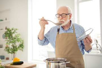 Close up photo grey haired he his him grandpa appetite waiting guests cooking favorite family dish...