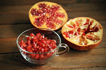 Tasty pomegranate on wood