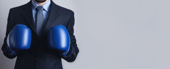 Businessman in boxing gloves. Business, Power, Sport