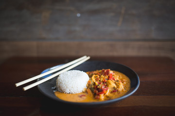 Spicy dish with rice and chopsticks