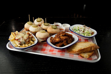 mini burgers, fries, salad, chicken wings