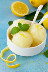 Homemade Fresh fruit lemon sorbet ice cream in a white bowl.