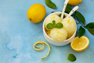 Homemade Fresh fruit lemon sorbet ice cream in a white bowl. Copy space. - obrazy, fototapety, plakaty
